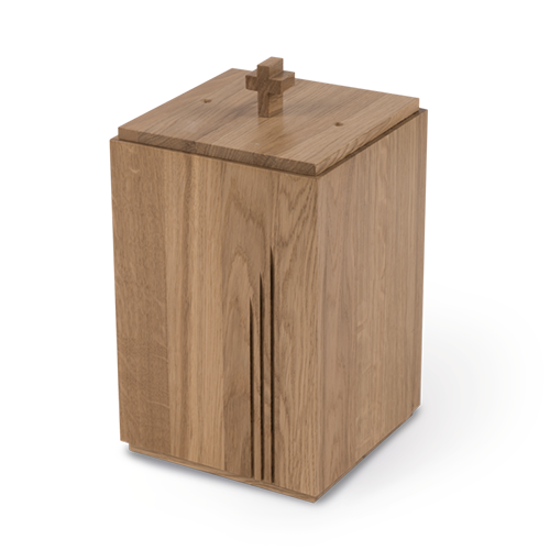 A natural colored wooden urn with carvings in front and a cross on top